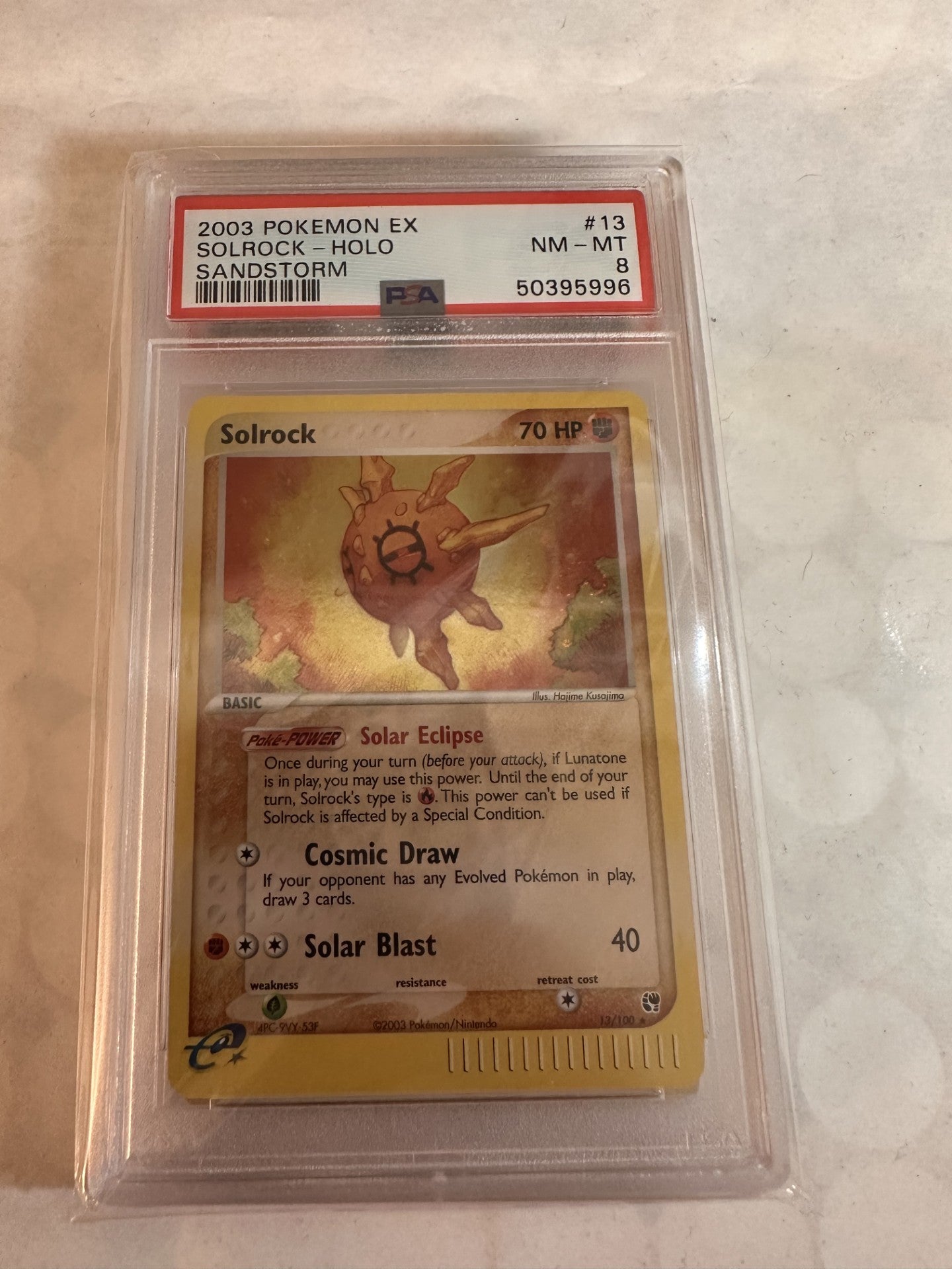 Solrock PSA 8 NM-MT graded slab — EX Sandstorm 13/100